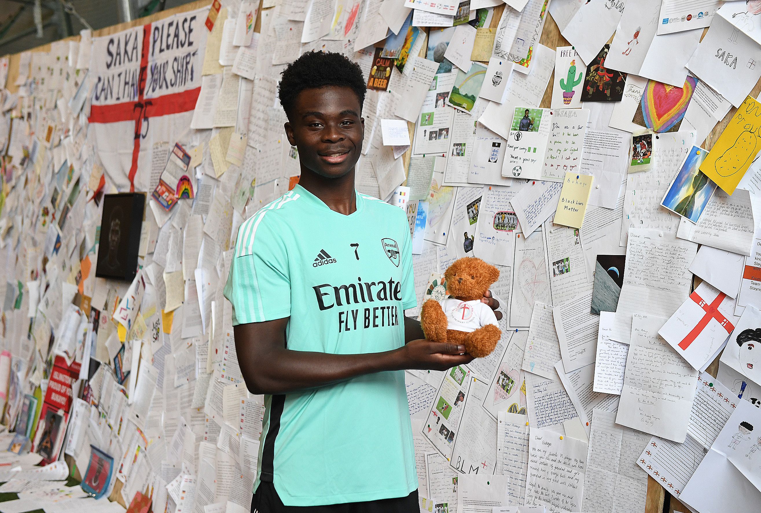 Bukayo Saka in front of a wall of letters he received from football fans following the European Championship