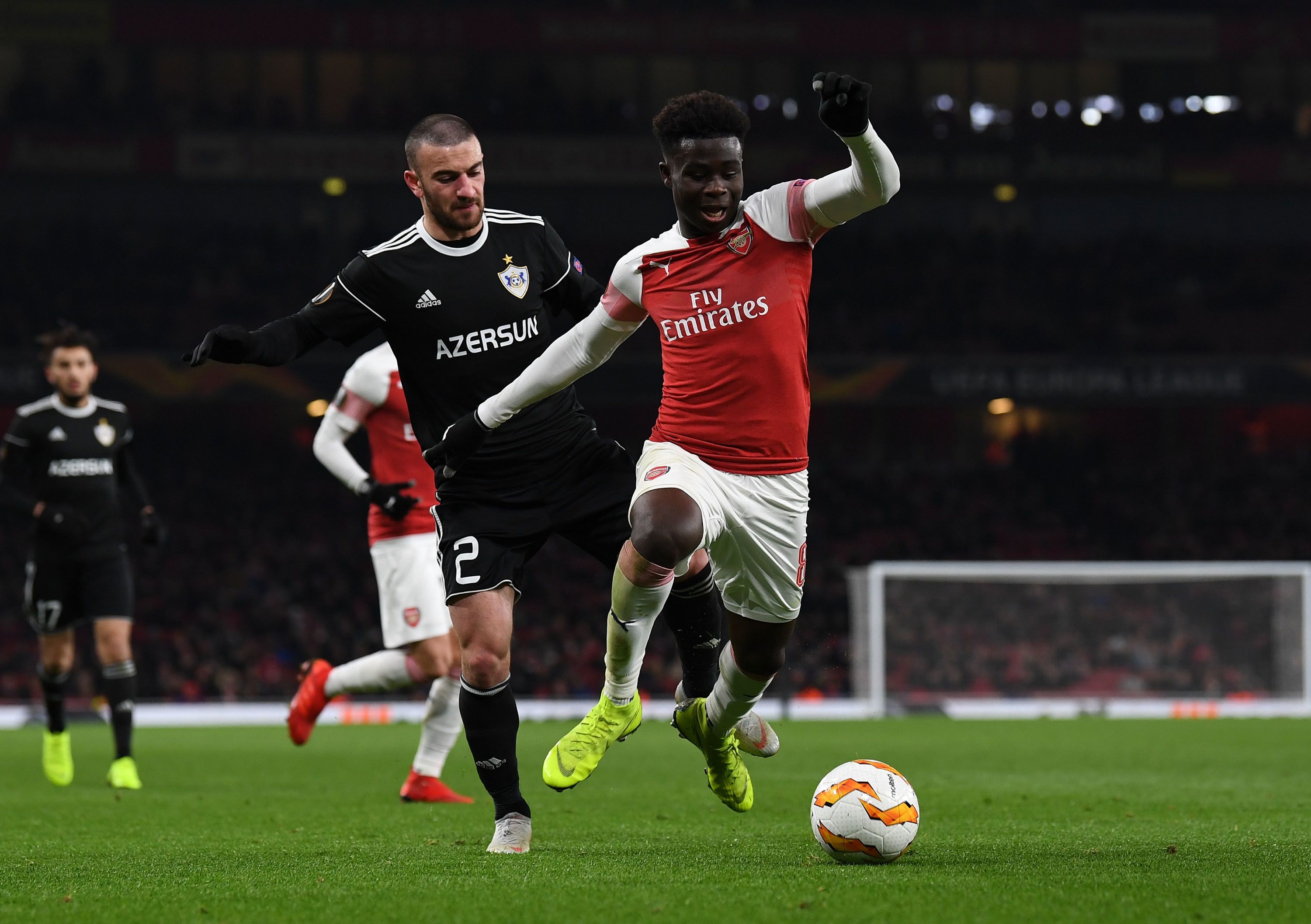 Bukayo Saka is tripped by Gara Garayev of Qarabag during a Europa League group stage match at Emirates Stadium on December 13, 2018