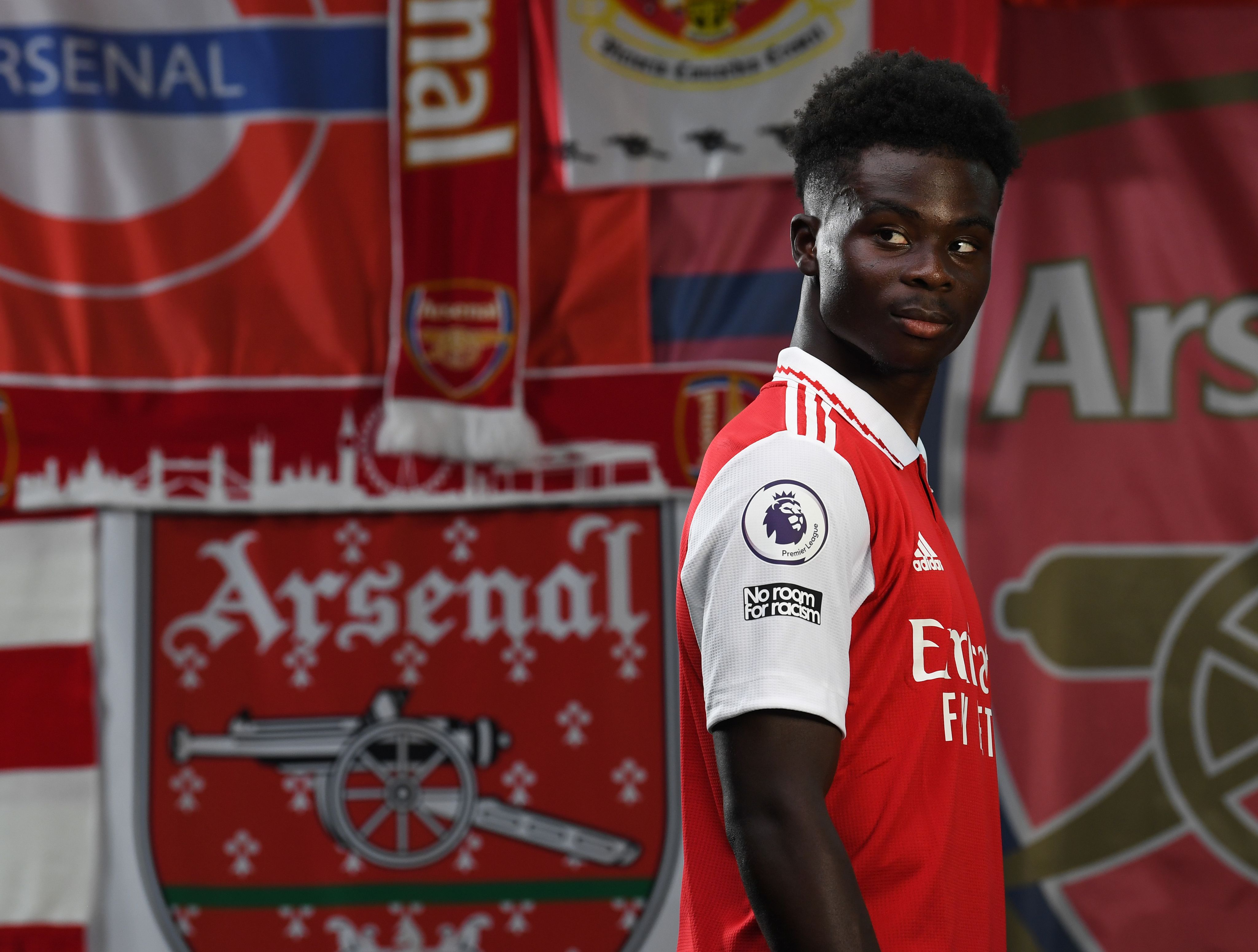 Bukayo Saka poses for cameras during the Arsenal Media Day in August 2022