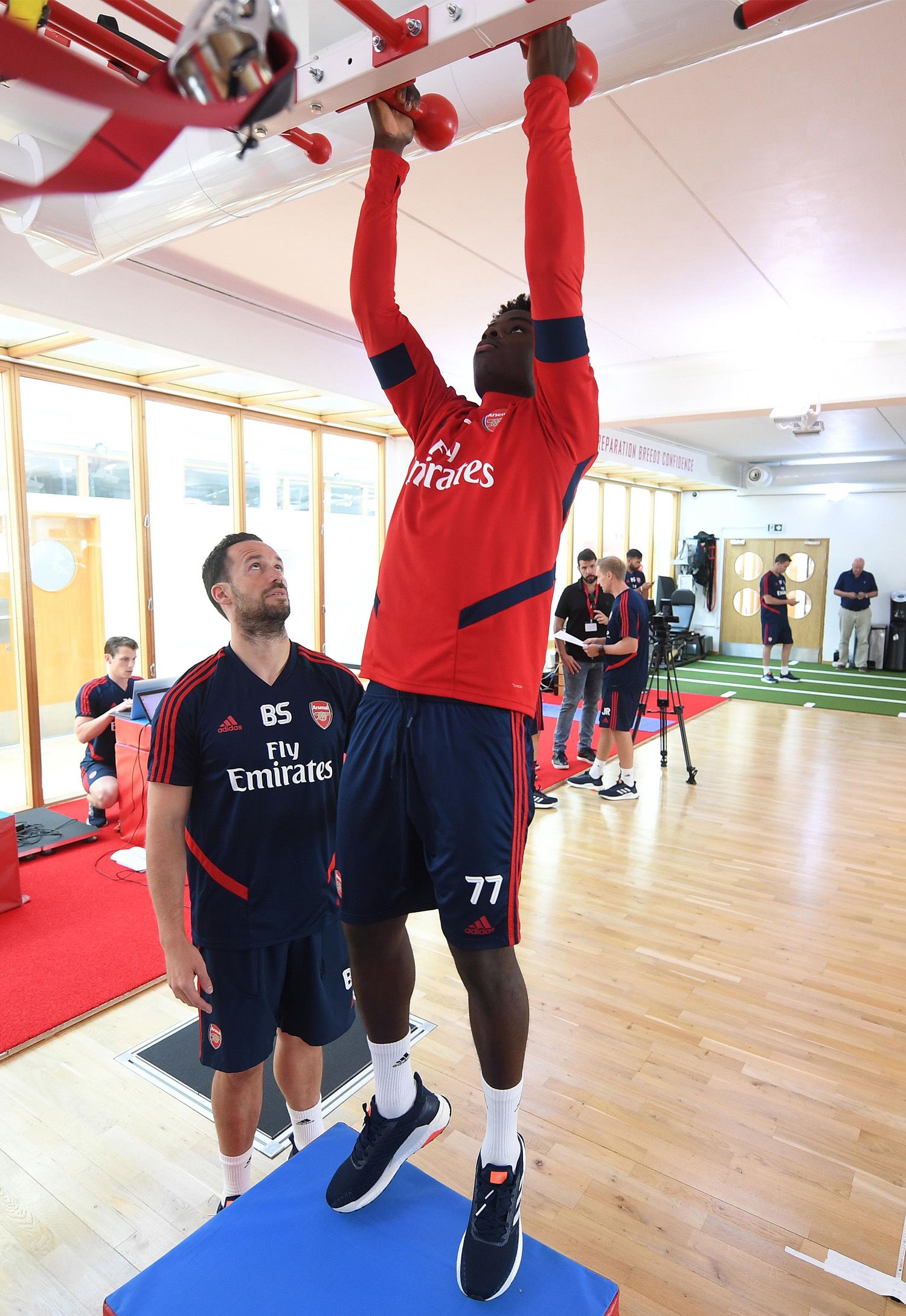 Bukayo Saka working in the gym with Barry Solan