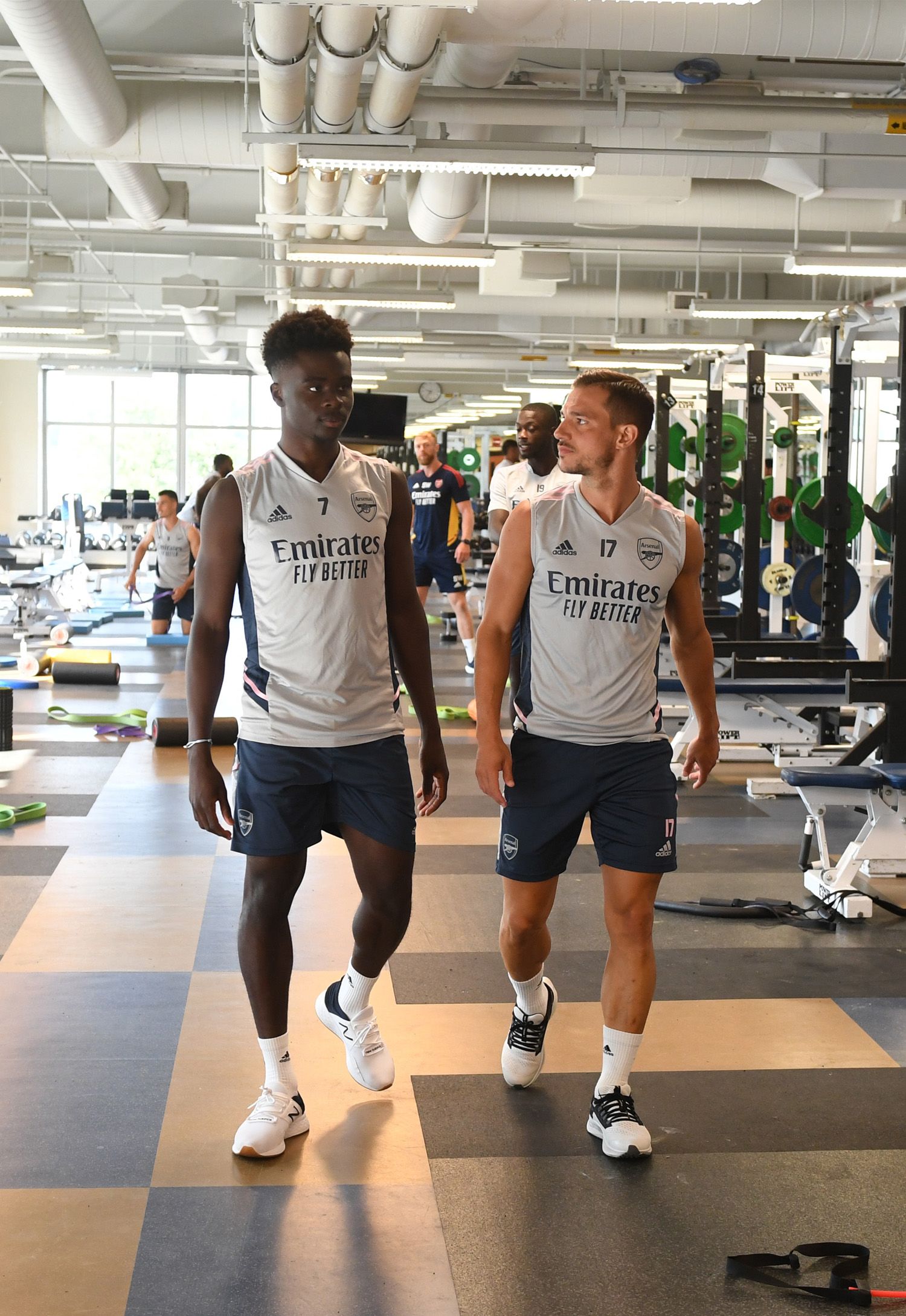 Bukayo Saka walking in the gym with Cedric